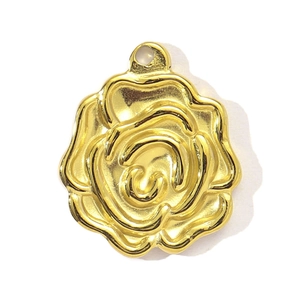 Detailed view of a gold rose charm featuring 3D embossed floral petals and hanging ring