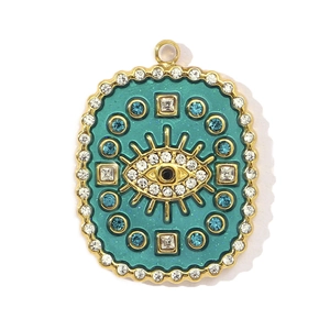 Detail view of oval evil eye pendant with turquoise enamel and sparkling crystals