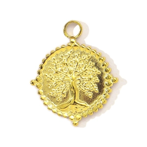 Detailed close-up of golden stainless steel Tree of Life pendant with embossed details