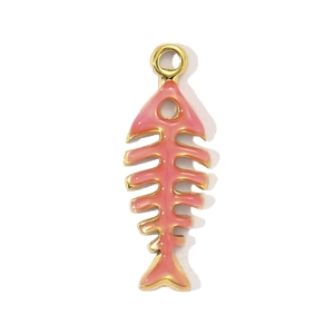 Macro detail of a pink fishbone pendant with golden stainless steel edges for necklaces