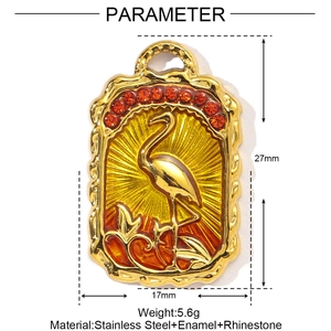 Detailed view of gold stainless steel flamingo pendant with enamel and red rhinestones