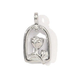 Detail view of silver rose pendant with arched frame and crystal accent on white background
