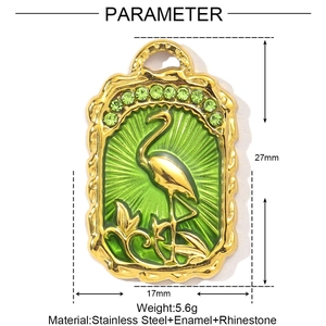 Detail view of rectangular flamingo pendant with green enamel and rhinestone accents