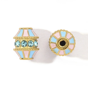 Detail of vintage lantern beads with pink and blue enamel and inset crystals