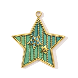 Detail of teal enamel star pendant with gold metal edges and blue rhinestones inlay