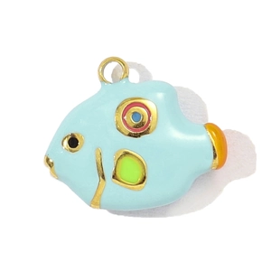 Macro detail of a colorful tropical fish pendant in blue enamel with gold plating for DIY jewelry