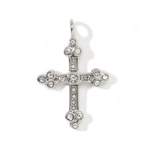 Macro detail of a vintage silver cross pendant with sparkling zircon micro-pave crystals