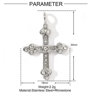 Macro detail of stainless steel cross pendant with rhinestones and 30x19mm dimensions