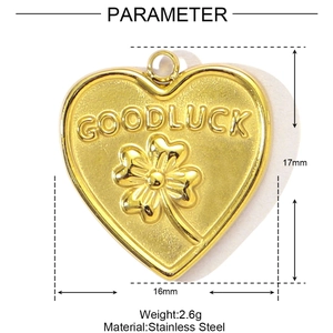 Detailed view of golden stainless steel heart pendant with clover and GOODLUCK engraving