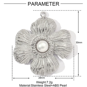 Detailed view of a vintage silver stainless steel flower pendant with a white pearl center