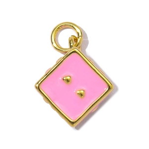 Detailed view of pink enamel cube pendant with gold-plated edges and zircon accents
