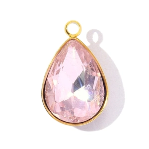 Close-up of pink teardrop crystal pendant with gold-plated stainless steel frame