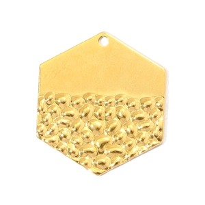 Detailed shot of hexagonal titanium steel pendant with half mirror and half hammered finish