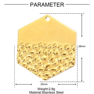 Detailed view of 26mm gold hexagon pendant with hammered texture and smooth finish
