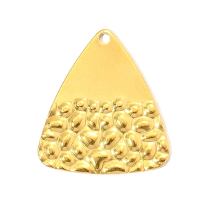 Detailed macro view of the hammered texture and polished finish on the golden steel pendant