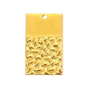 Detail of gold rectangular pendant with smooth top and hammered texture on the bottom