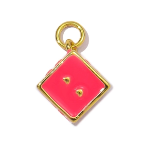 Detailed macro view of magenta enamel diamond pendant with gold plated trim and hanging ring