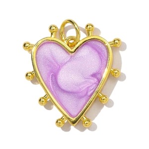 Close-up of heart-shaped gold-framed pendant with shimmering purple enamel fill