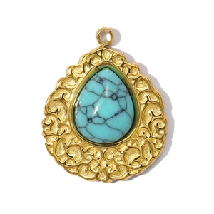 Detailed view of teardrop natural turquoise stone in vintage gold stainless steel frame