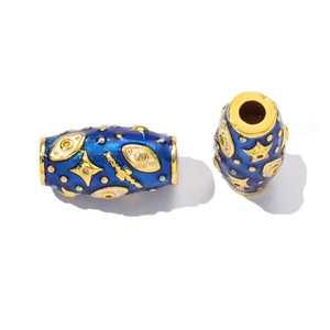 Detailed macro view of deep blue enamel evil eye charm bead with gold celestial patterns
