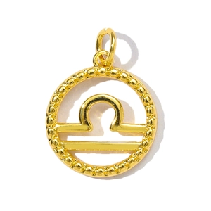 Detail of a Libra zodiac pendant in gold finish with beaded edges and center symbol
