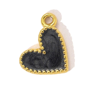 Close-up of heart-shaped pendant with beaded gold edges and black matte finish center