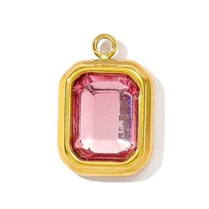 Detailed view of emerald-cut pink crystal pendant with gold-plated stainless steel frame