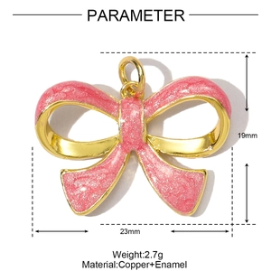 Detail view of pink glitter bow pendant with gold plating showing dimensions 23mm by 19mm