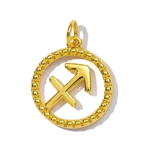 Detailed macro of a gold Sagittarius zodiac pendant with beaded border and polished finish