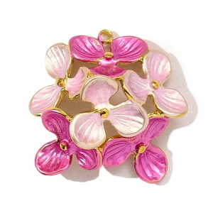 Detail of pink enamel tulip flower pendant with gold plating on stainless steel frame