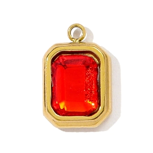 Macro shot of French vintage gold-plated rectangular red gem pendant with a top bail