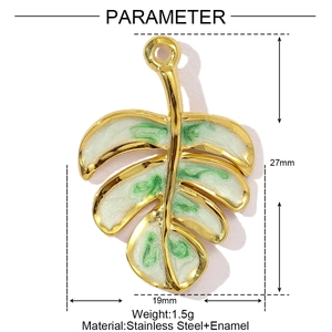 Macro view of leaf pendant in gold stainless steel and enamel with 27mm size specs