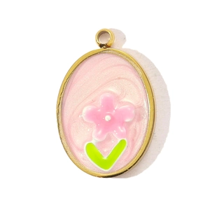 Detail of oval enamel rose pendant with pink flower and green leaf on gold metal base