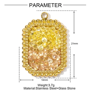 Macro detail of rectangle gold stainless steel pendant with yellow gradient rhinestones