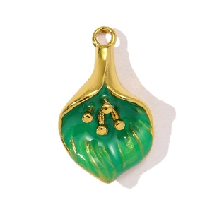 Macro detail of tulip flower pendant with green enamel and gold stainless steel base