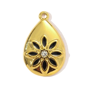 Detail of teardrop pendant with black enamel flower and sparkling center crystal