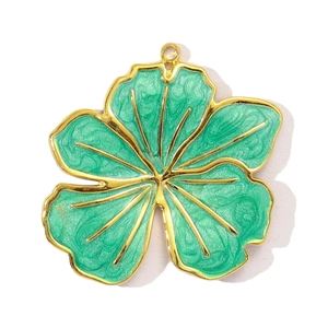 Macro detail of tulip flower pendant with teal enamel and gold stainless steel edges