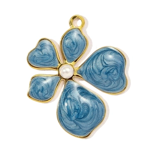 Detail of blue marble enamel hydrangea pendant with gold edge and pearl center