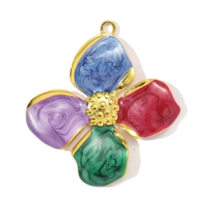 Detailed close-up of a colorful enamel floral pendant with gold metal edges
