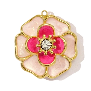 Close-up of pink tulip pendant in gold stainless steel with a zircon center stone