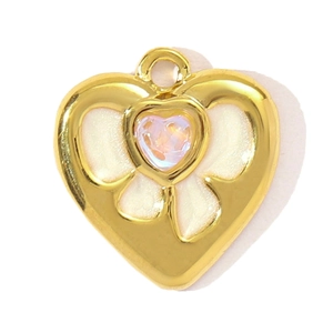 Detail of a gold heart pendant featuring an iridescent center stone and white enamel
