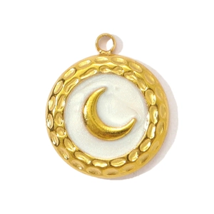 Detailed macro view of a round gold moon pendant with textured edges and white enamel center