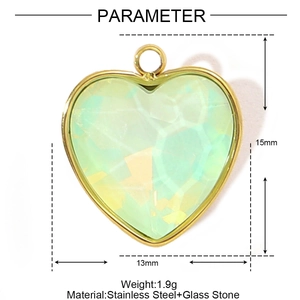 Detailed view of heart-shaped green glass pendant with golden stainless steel frame