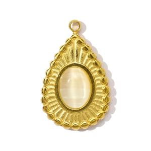 Vintage gold teardrop pendant with cat eye stone and sunburst radiant texture