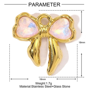 Detailed view of a golden stainless steel bow pendant with pink heart-shaped glass stones