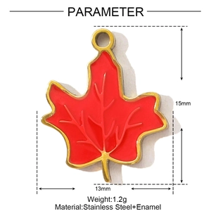 Detailed view of 15mm red enamel maple leaf pendant in gold stainless steel finish