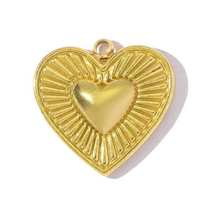 Detail showing a golden heart pendant with sunburst texture and circular hanging ring
