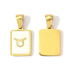 Detailed macro view showing both sides of a gold Taurus zodiac square shell pendant