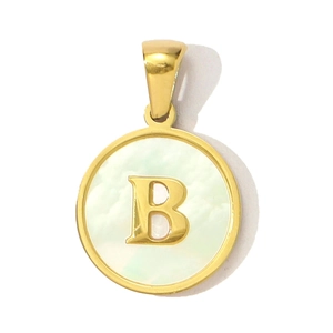 Macro detail of round gold pendant with natural shell inlay and golden letter B