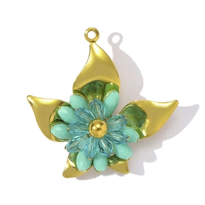 Detailed view of handcrafted crystal flower pendant with blue petals and golden leaves